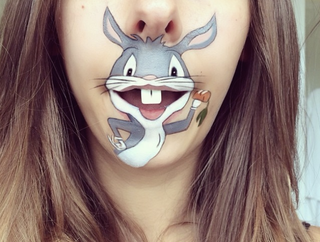 Illustration for article titled Girl transforms her mouth into cute famous characters with just makeup